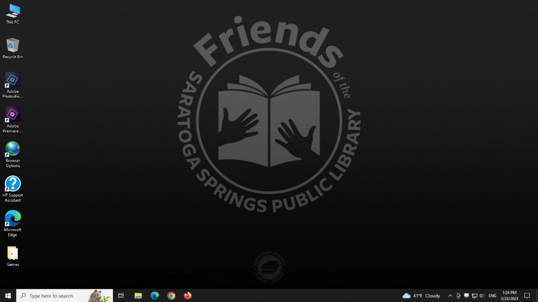 A screenshot of the desktop as it is configured for use in the Computer Lab computers. The Friends of the library logo is prominently displayed in the center.