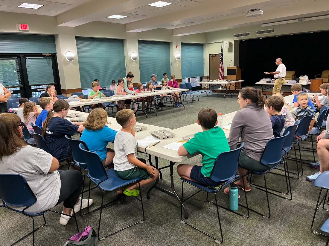 educator teaches families about nature