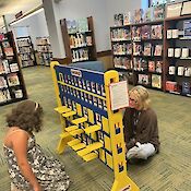 A larger version of: Patrons play Guess Who