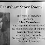Thumbnail: A placque honoring the namesake of the room. Helen Crawshaw inspired the love of reading in thousands of children through her 26 year career as a librarian.