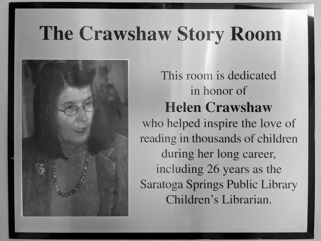 A placque honoring the namesake of the room. Helen Crawshaw inspired the love of reading in thousands of children through her 26 year career as a librarian.