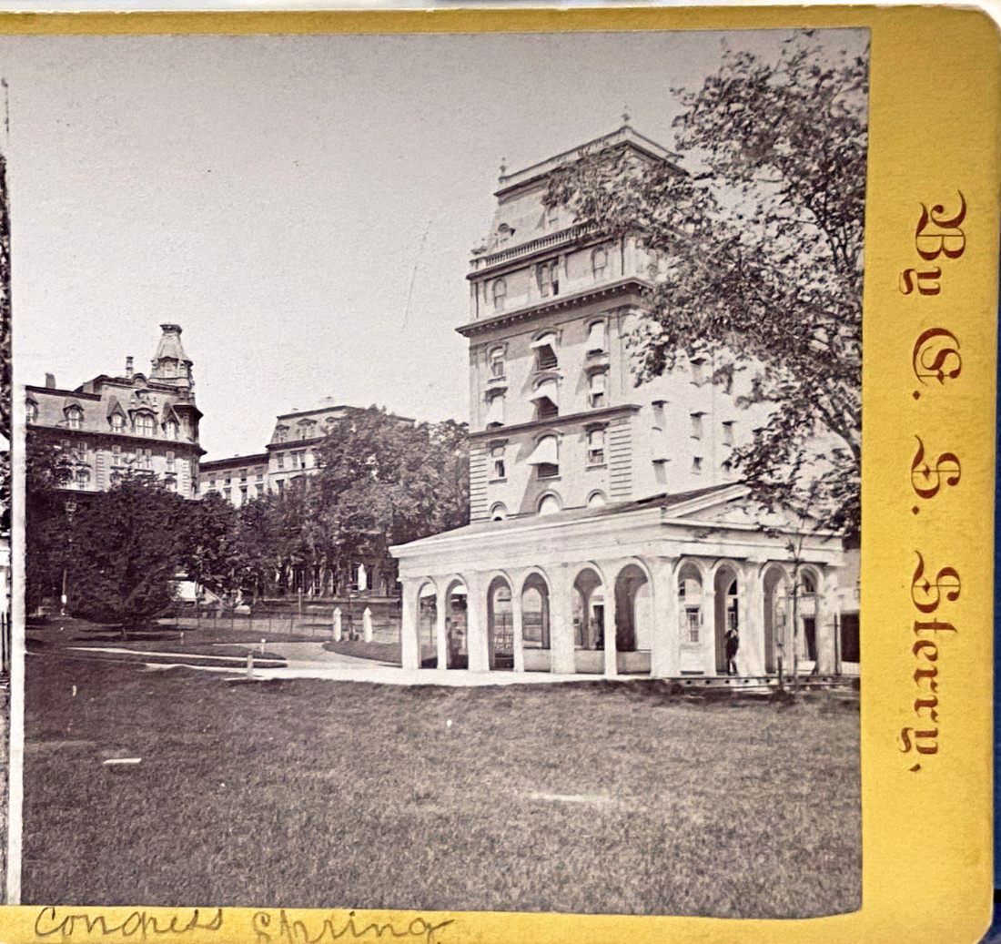 An old photo of the Congress Spring pavillion. The photographer’s name, C. S. Sterry, is printed on its side.