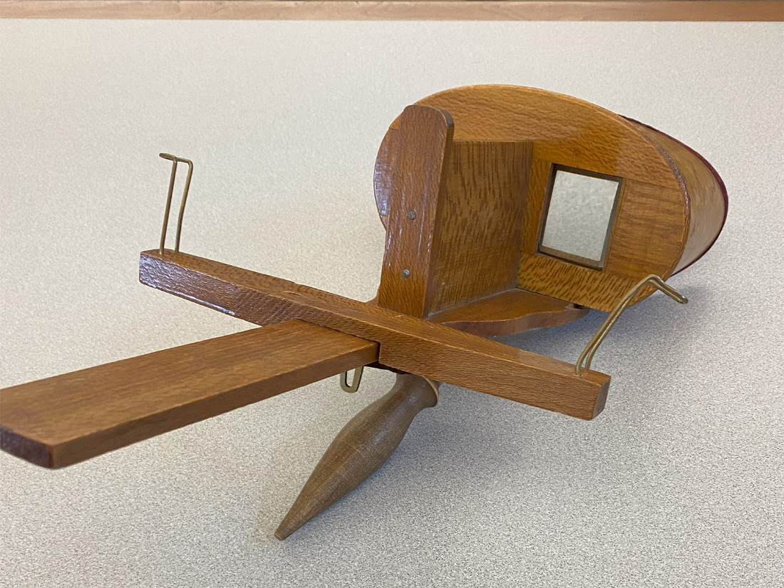 The original VR headset: a wooden stereoscope.